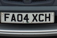 Identify the letters and numbers in this image