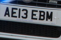 Identify the letters and numbers in this image
