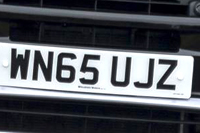Identify the letters and numbers in this image