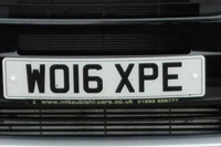 Identify the letters and numbers in this image