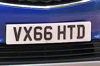 Identify the letters and numbers in this image