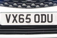 Identify the letters and numbers in this image
