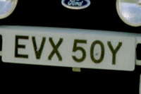 Identify the letters and numbers in this image