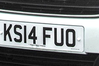 Identify the letters and numbers in this image