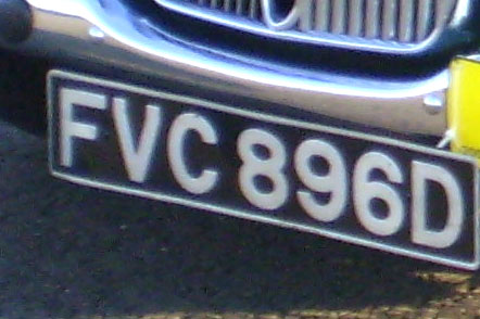 Identify the letters and numbers in this image